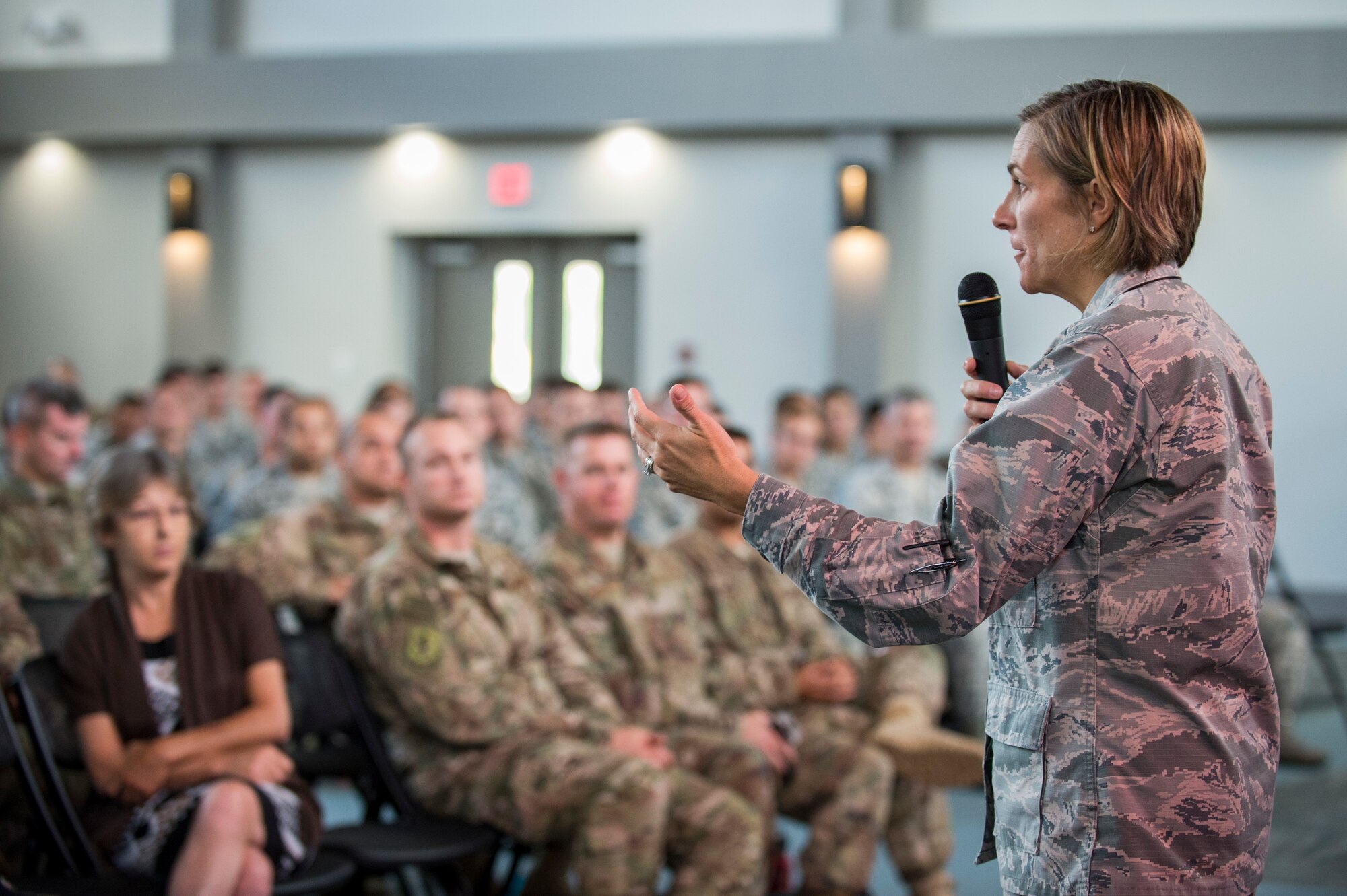 Col. Jennifer Short, 23d Wing commander, addresses Team Moody during a commander’s call, Sept. 24, 2018, at Moody Air Force Base, Ga. Short used the opportunity to communicate directly with Team Moody Airmen, update them on local and national objectives and initiatives and highlight superior performers. (U.S. Air Force photo by Andrea Jenkins)