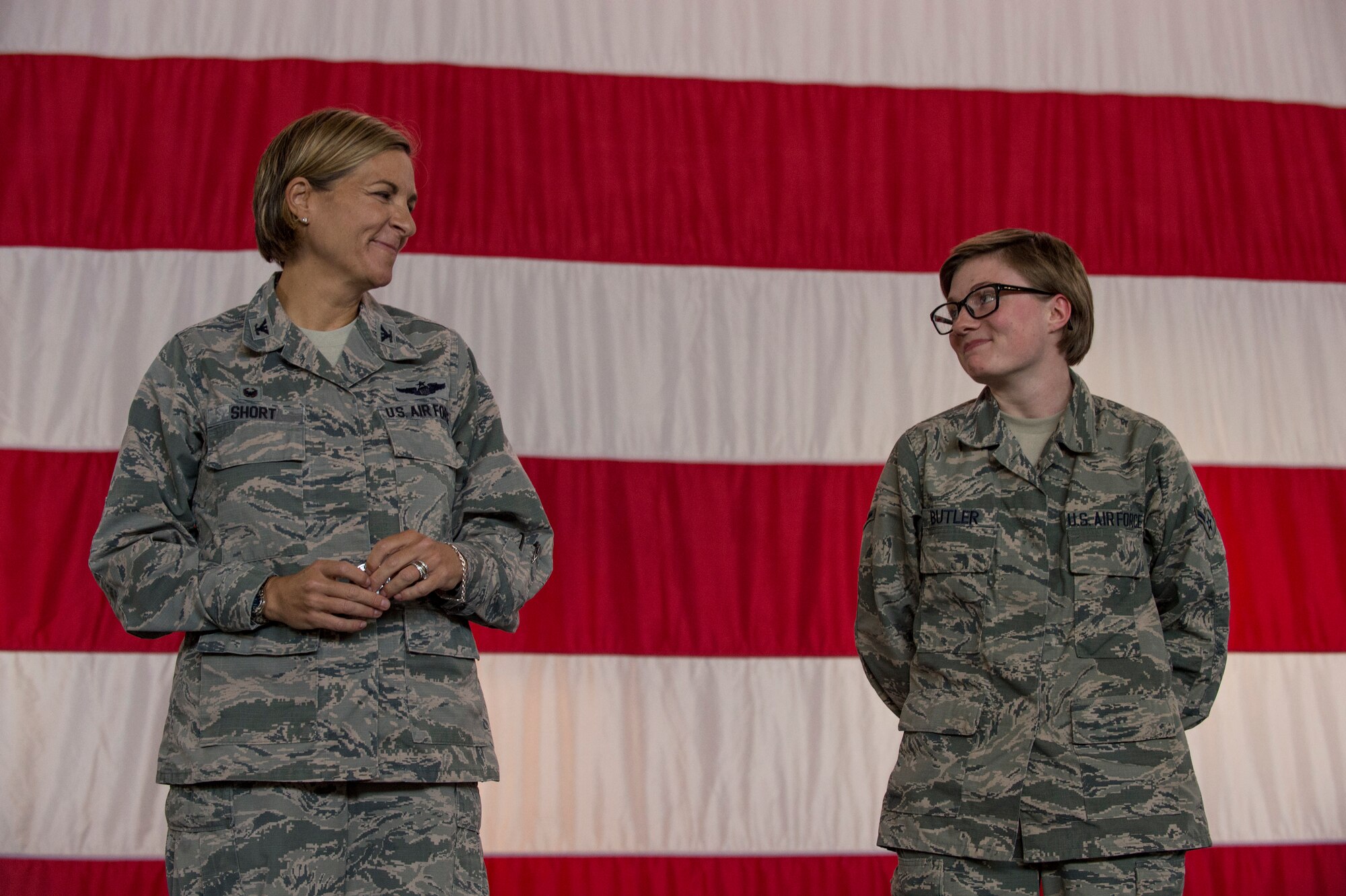 Col. Jennifer Short, 23d Wing commander, presents a Superior Performer Award to Airman Taryn Butler for her performance as a 23d Wing Public Affairs apprentice during a commander’s call, Sept. 24, 2018, at Moody Air Force Base, Ga. Butler was one of 12 Airmen recognized by Short for superior performance whose hard work and dedication propelled the mission. (U.S. Air Force photo by Andrea Jenkins)