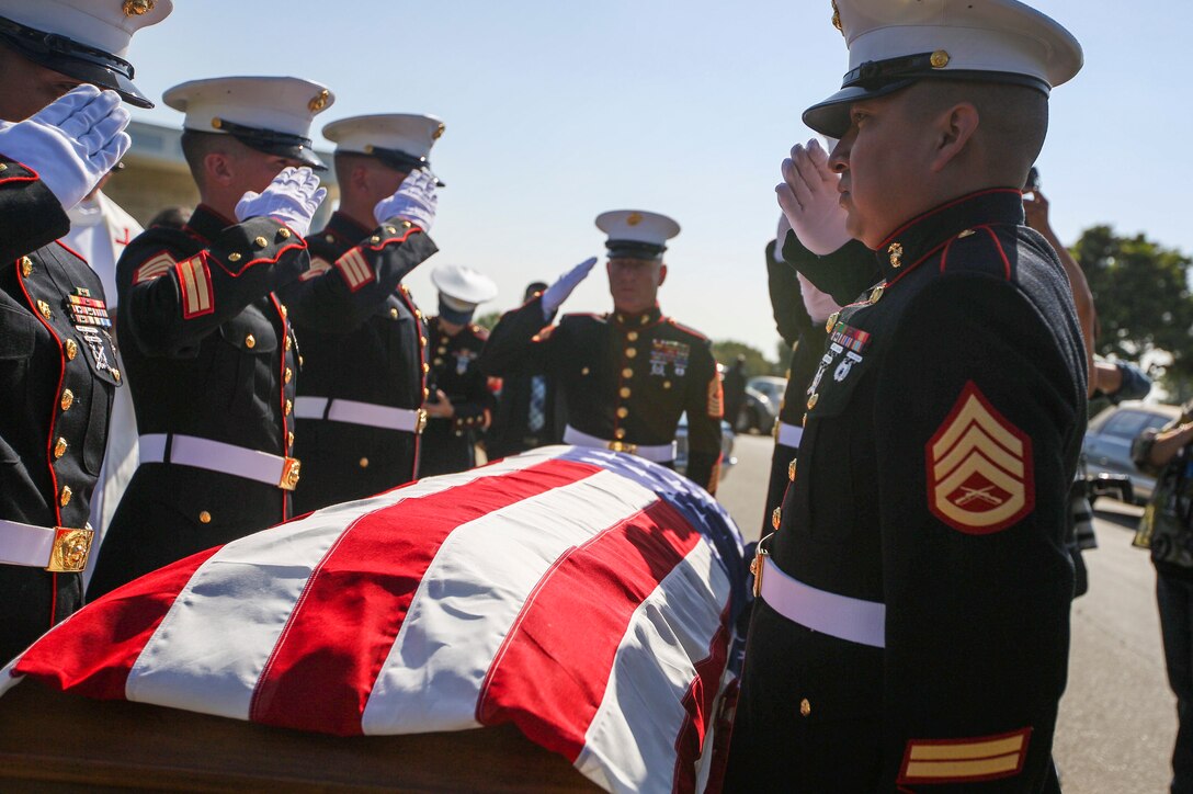 U.S. Marines with the Company F, 2nd Battalion, 7th Marine Regimant, 1st Marine Division, Color Guard, render a salute to Pfc. Roger Gonzales during his funeral service at the Green Hill Mortuary and Memorial Chaple, Rancho Palos Verdes, California, Sept. 21, 2018.