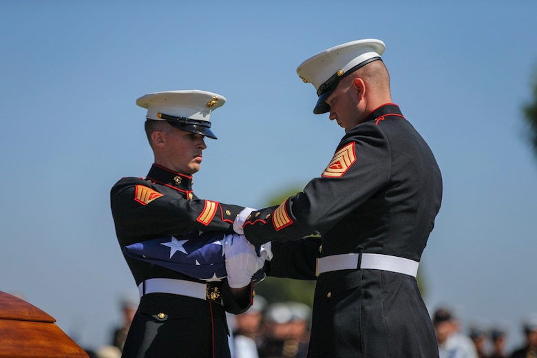 U.S. Marines with the Company F, 2nd Battalion, 7th Marine Regimant, 1st Marine Division, Color Guard, fold an American flag, during Pfc. Roger Gonzales' funeral service at the Green Hill Mortuary and Memorial Chaple, Rancho Palos Verdes, California, Sept. 21, 2018.
