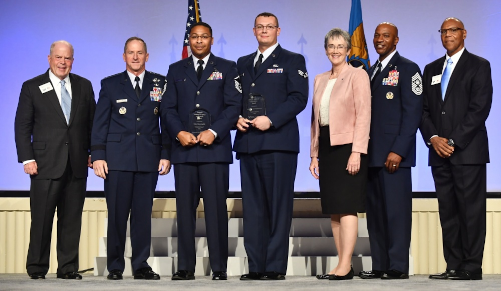 Master Sgt. Louis Lusco, third from left, and Senior Airman Dakota Williamson received the Gen. Spencer Innovation Award - Team from Chief of Staff of the Air Force Gen. David L. Goldfein, second from left, Secretary of the Air Force Heather Wilson, third from right, Chief Master Sgt. of the Air Force Kaleth Wright, second from right, Gen. (ret.) Larry Spencer, far right, and Whit Peters, Chairman of the Air Force Association Board, far left, during the AFA Air, Space and Cyber Conference in National Harbor, Md., Sept. 17, 2018. Lusco and Williamson are part of the maintenance Top Coat Team at MacDill Air Force Base, Fla. (U.S. Air Force photo by Staff Sgt. Rusty Frank)