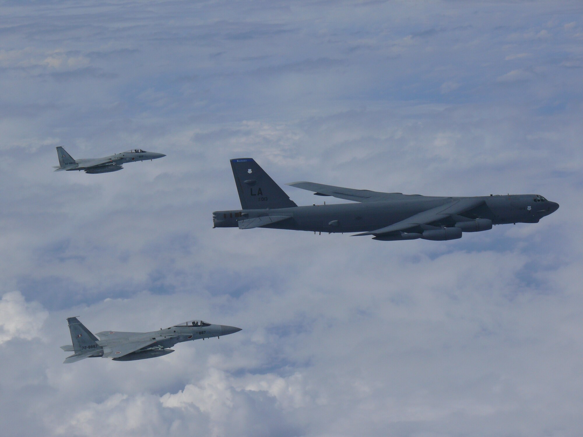 A U.S. Air Force B-52H Stratofortress bomber and two Koku Jieitai (Japan Air Self-Defense Force) F-15 fighters execute a routine bilateral training mission over the East China Sea and the Sea of Japan, Sept. 26, 2018.