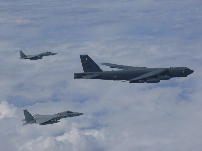 A U.S. Air Force B-52H Stratofortress bomber and two Koku Jieitai (Japan Air Self-Defense Force) F-15 fighters execute a routine bilateral training mission over the East China Sea and the Sea of Japan, Sept. 26, 2018.