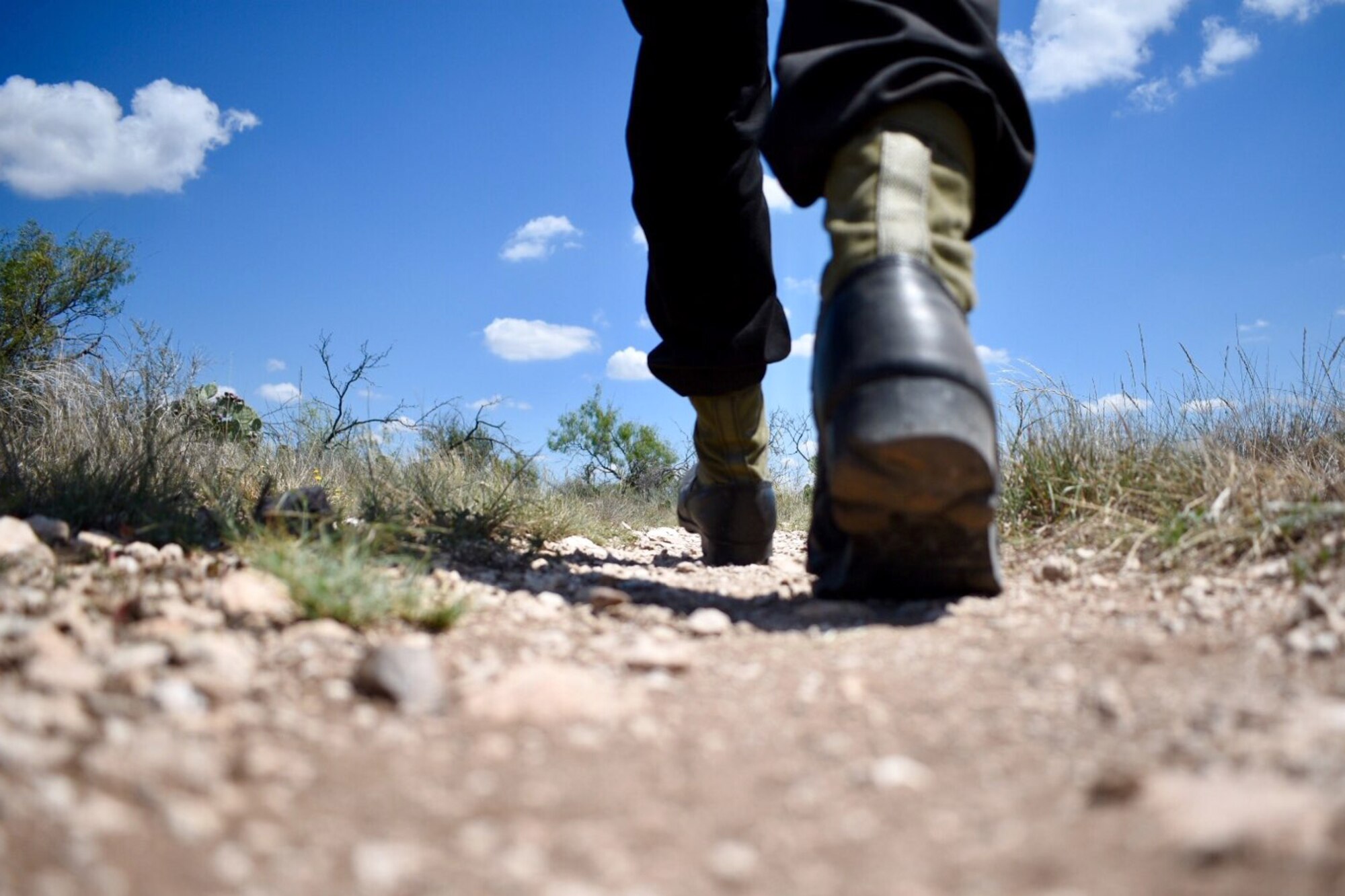 Hikers should wear proper footwear such as, boots, ankle boots or sturdy tennis shoes. In hot weather, shirts should be opaque, bright and loose fitting. (Courtesy photo by Randall Moose)