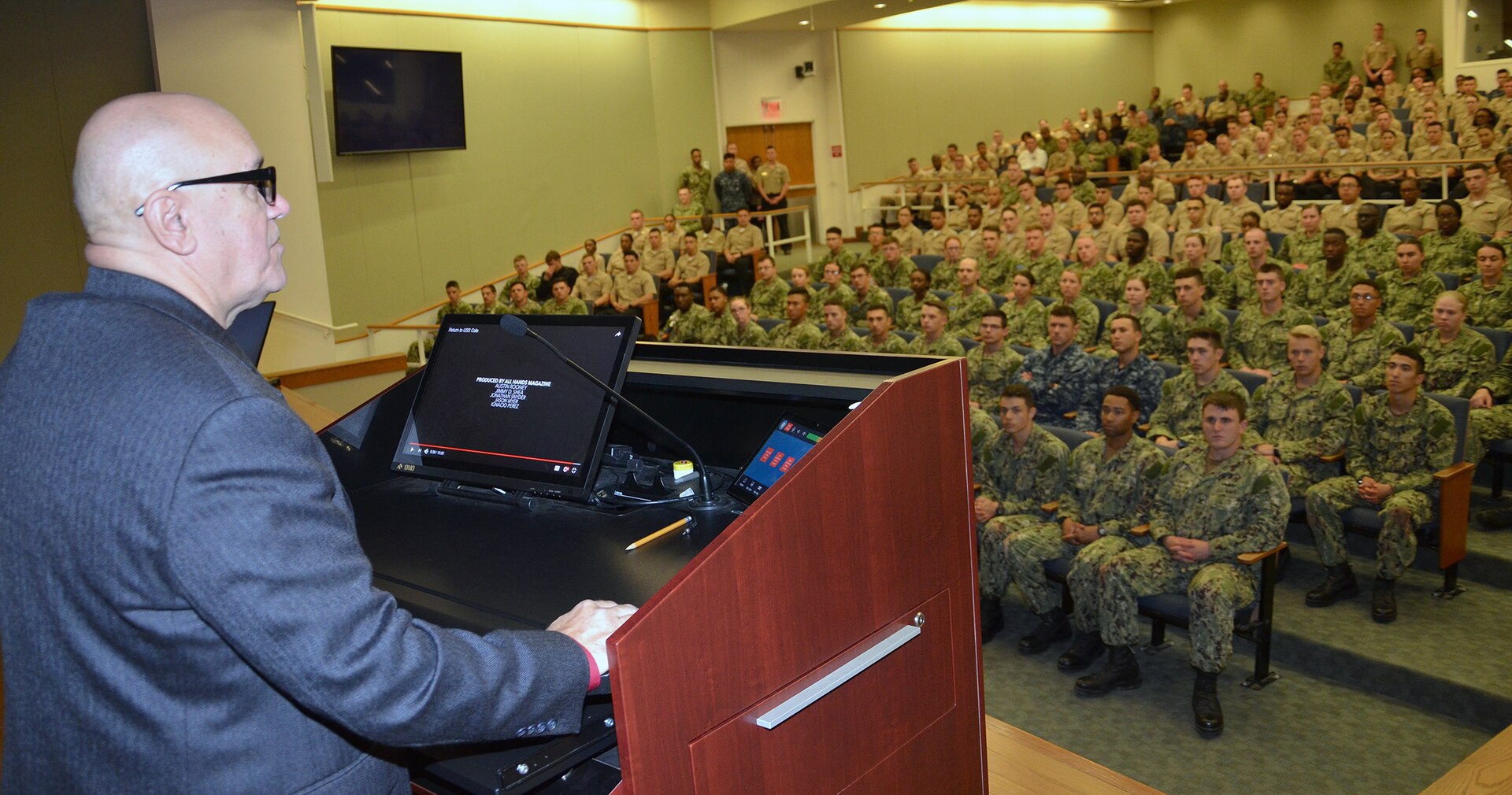 Retired Master Chief James Parlier addresses a standing-room-only audience of Navy students and staff from the Hospital Corpsman Basic program at the Medical Education and Training Campus at Joint Base San Antonio-Fort Sam Houston Sept. 21.