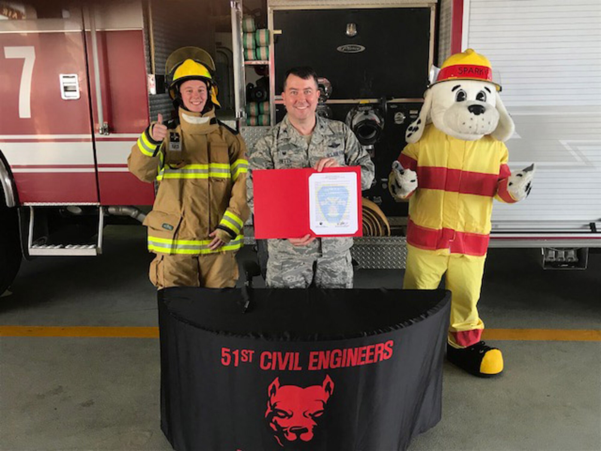 Col. William Betts, 51st Fighter Wing commander, signs the annual Fire Prevention Week proclamation on Osan Air Base, Republic of Korea, Sept. 27, 2018.
