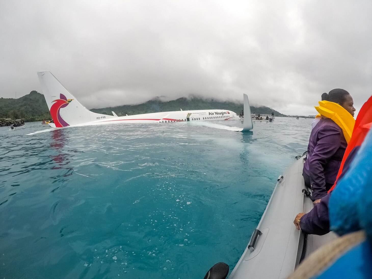 CHUUK, Federated States of Micronesia (Sept. 28, 2018) U.S. Navy Sailors from Underwater Construction Team (UCT) 2 assist local authorities in shuttling the passengers and crew of Air Niugini flight PX56 to shore following the plane crashing into the sea on its approach to Chuuk International Airport in the Federated States of Micronesia.