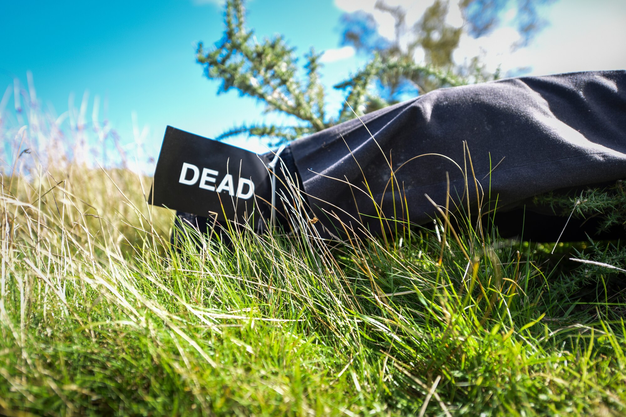 A mannequin with a “dead” tag lays at the mock crash site during an exercise at a training filed near RAF Leeming, England Sept. 26, 2018. The scenario tested emergency responses of multiple agencies to a simulated military aircraft crash in the Northeast area of RAF Leeming’s area of responsibility and a fuel spill at RAF Waddington. (U.S. Air Force photo by Tech. Sgt. Emerson Nuñez)