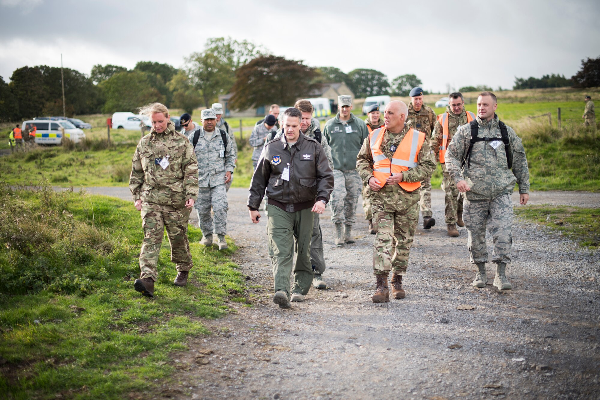 U.S. Air Force Airmen speak with Royal Air Force airmen about emergency procedures during an exercise at a training filed near RAF Leeming, England, Sept. 26, 2018. The scenario tested emergency responses of multiple agencies to a simulated military aircraft crash in the Northeast area of RAF Leeming’s area of responsibility and a fuel spill at RAF Waddington. (U.S. Air Force photo by Tech. Sgt. Emerson Nuñez)
