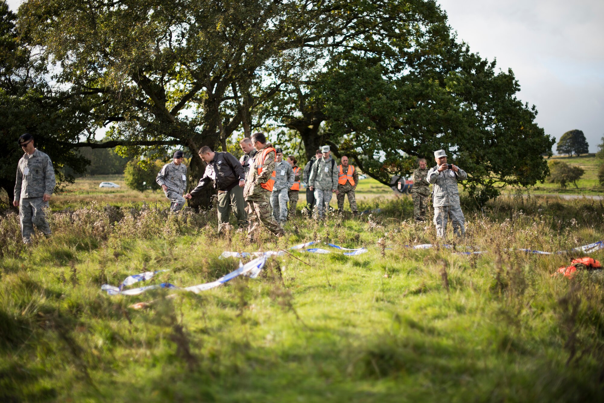 U.S. Air Force and Royal Air Force Airmen comb through a mock crash site during an exercise at a training filed near RAF Leeming, England Sept. 26, 2018. This exercise was the biggest conducted in the area in the past 10 years. (U.S. Air Force photo by Tech. Sgt. Emerson Nuñez)