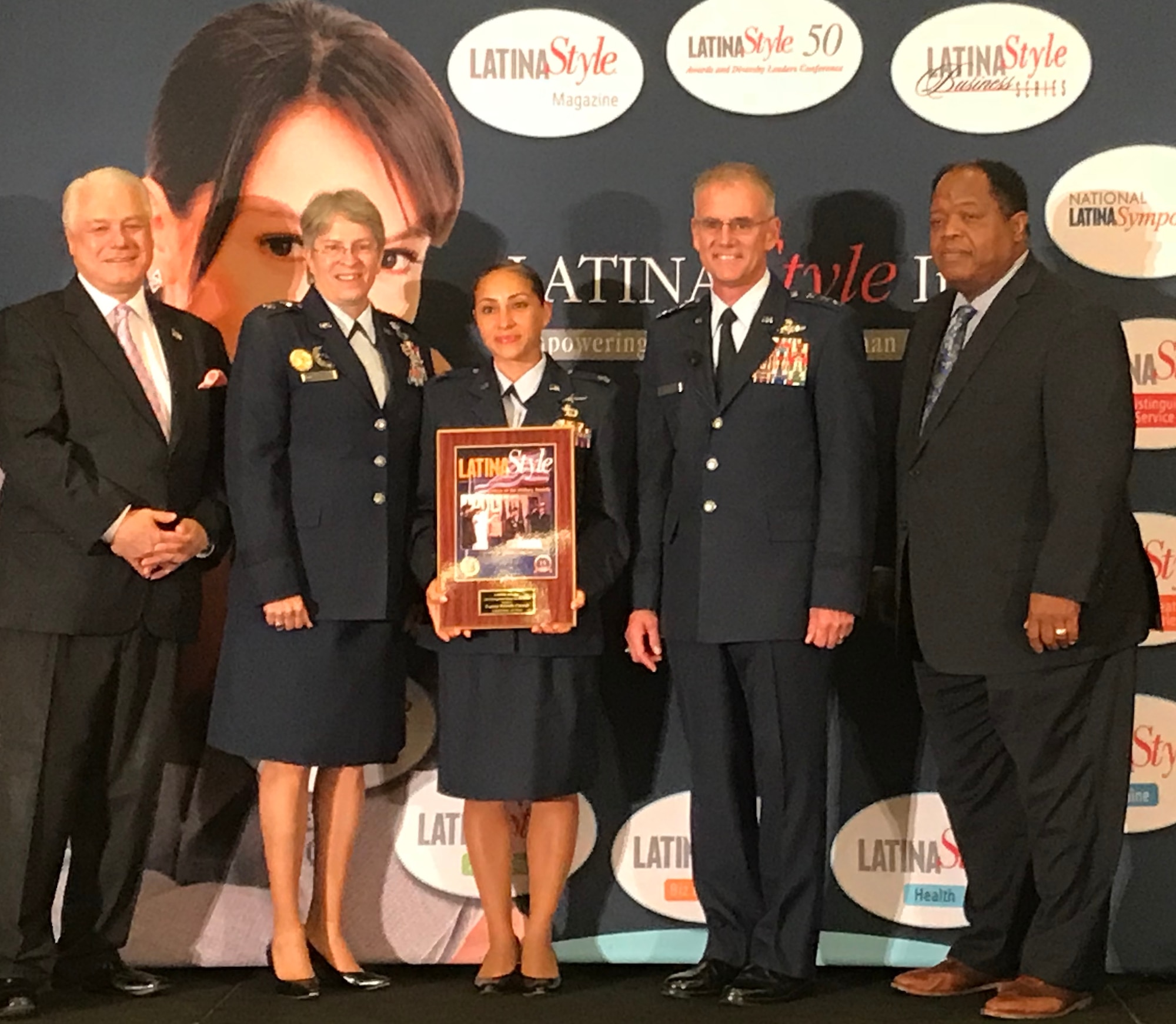 U.S Air Force Capt. Michelle Cazares poses with leadership for a Latina Style Distinguished Military Service Award ceremony in Washington D.C.