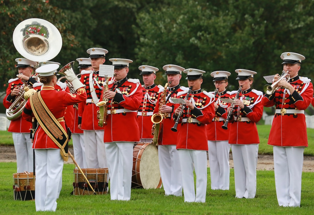 Gunnery Sgt. Stacie Crowther, assistant drum major, “The President’s Own” U.S. Marine Band, conducts members of the band during a full honors funeral for three formerly unaccounted for Vietnam veterans at Arlington National Cemetery, Arlington, Va., Sept. 27, 2018.