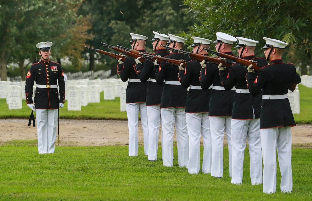 Marines with the Bravo Company firing party, Marine Barracks Washington D.C., render a three-volley salute during a full honors funeral for three formerly unaccounted for Vietnam veterans at Arlington National Cemetery, Arlington, Va., Sept. 27, 2018.