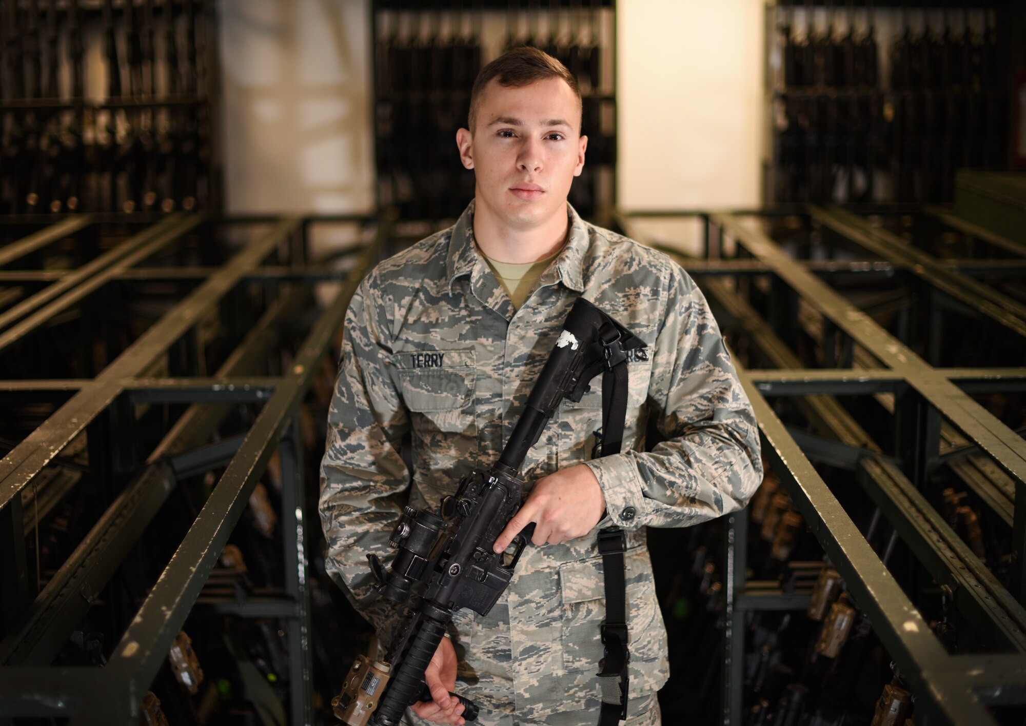 U.S. Air Force Airman 1st Class Nicholas Terry, 100th Security Forces Squadron armorer, poses for a photo at RAF Mildenhall, England, Sept. 25, 2018. Airmen assigned to the armory are responsible for arming and de-arming security forces Airmen during each shift change, as well as ensuring issued weapons are being cleaned properly. (U.S. Air Force photo by Airman 1st Class Brandon Esau)