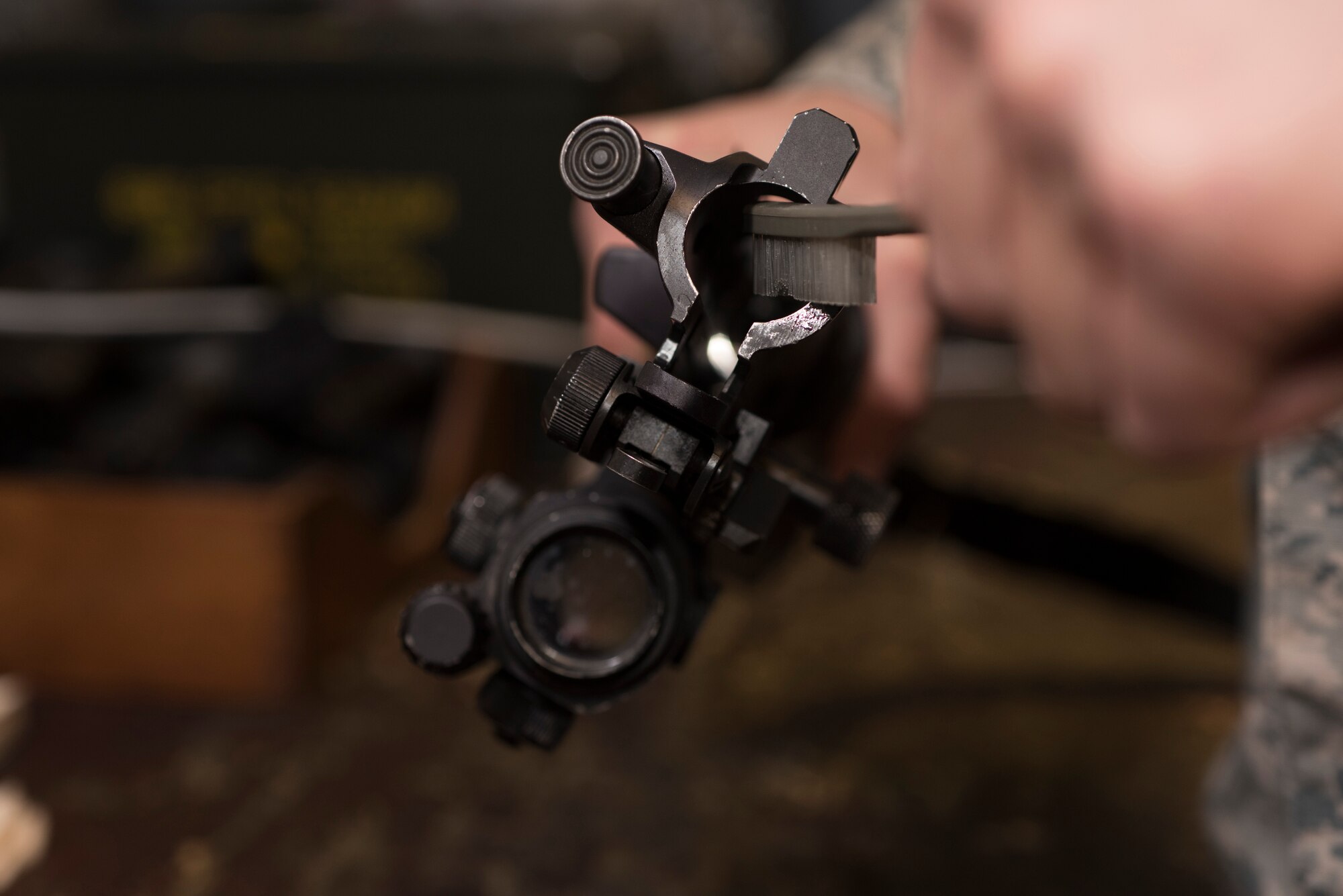 U.S. Air Force Airman 1st Class Nicholas Terry, 100th Security Forces Squadron armorer, cleans an M-4 carbine rifle bolt carrier at RAF Mildenhall, England, Sept. 25, 2018. After each shift, weapons must be cleared by security forces Airmen, and then turned into the armory for security until the individual needs it again for duty. (U.S. Air Force photo by Airman 1st Class Brandon Esau)
