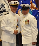 IMAGE: DAHLGREN, Va. (Sept. 11, 2018) – Senior Chief Fire Controlman Jeremy Brown (ret.) and U.S. Navy Ensign Dillard Patton moments after Brown rendered the first enlisted salute to Patton who then returned the salute at his commissioning ceremony held at the Aegis Training and Readiness Center. In accordance with tradition, Patton - an NSWCDD System Safety Engineering Division civilian engineer - presented a brand new silver dollar to Brown as the first enlisted service member who saluted him.