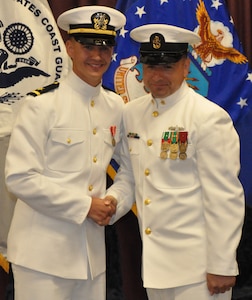 IMAGE: DAHLGREN, Va. (Sept. 11, 2018) – Senior Chief Fire Controlman Jeremy Brown (ret.) and U.S. Navy Ensign Dillard Patton moments after Brown rendered the first enlisted salute to Patton who then returned the salute at his commissioning ceremony held at the Aegis Training and Readiness Center. In accordance with tradition, Patton - an NSWCDD System Safety Engineering Division civilian engineer - presented a brand new silver dollar to Brown as the first enlisted service member who saluted him.