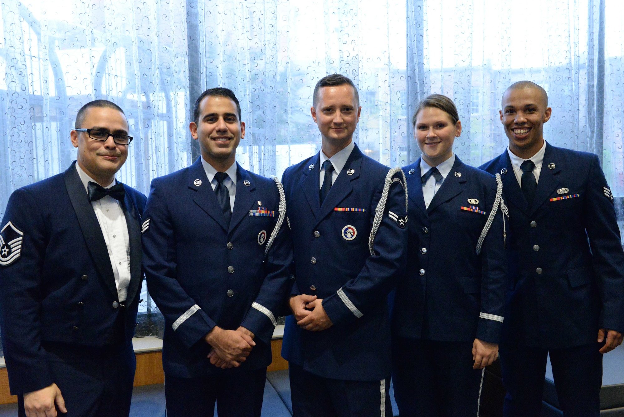 Airmen from Columbus Air Force Base, Mississippi, pose for a photo at the 2018 Air Force Birthday Ball Sept. 22, 2018 in Columbus, Mississippi. Airmen, family and the local community gather every year and reflect on the partnership the base and the local community have shared for 77 years. (U.S. Air Force photo by 1st Lt. Kara Crennan)