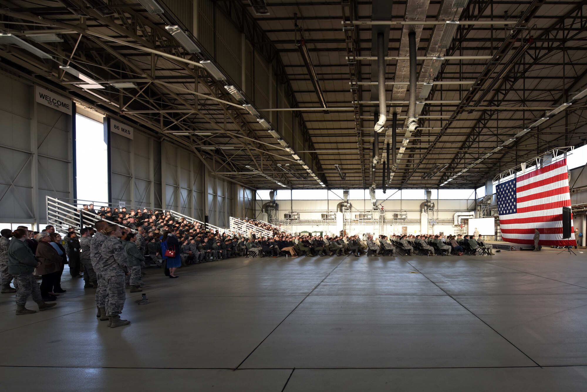 Ramstein Airmen sit at an all call on Ramstein Air Base, Germany, Sept. 27, 2018. Brig. Gen. Mark August, 86th Airlift Wing commander, laid out his expectations, priorities and vision for the 86th Airlift Wing.