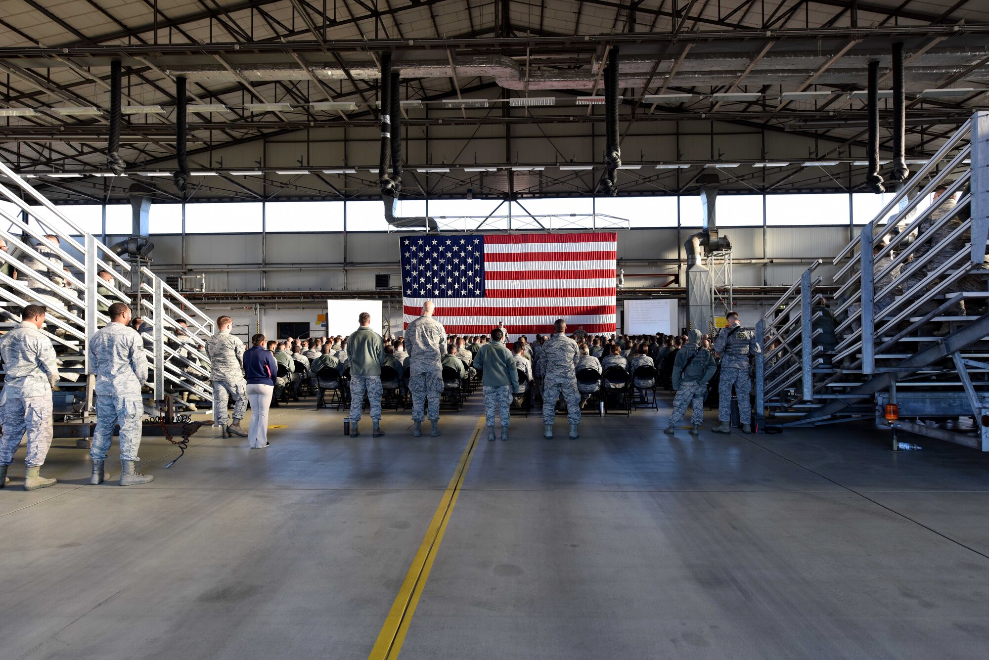 Ramstein Airmen listen to Brig. Gen. Mark August, 86th Airlift Wing commander, at an all call on Ramstein Air Base, Germany, Sept. 27, 2018. August spoke about the importance of readiness and the 86th Airlift Wing’s strategic importance to global U.S. operations.