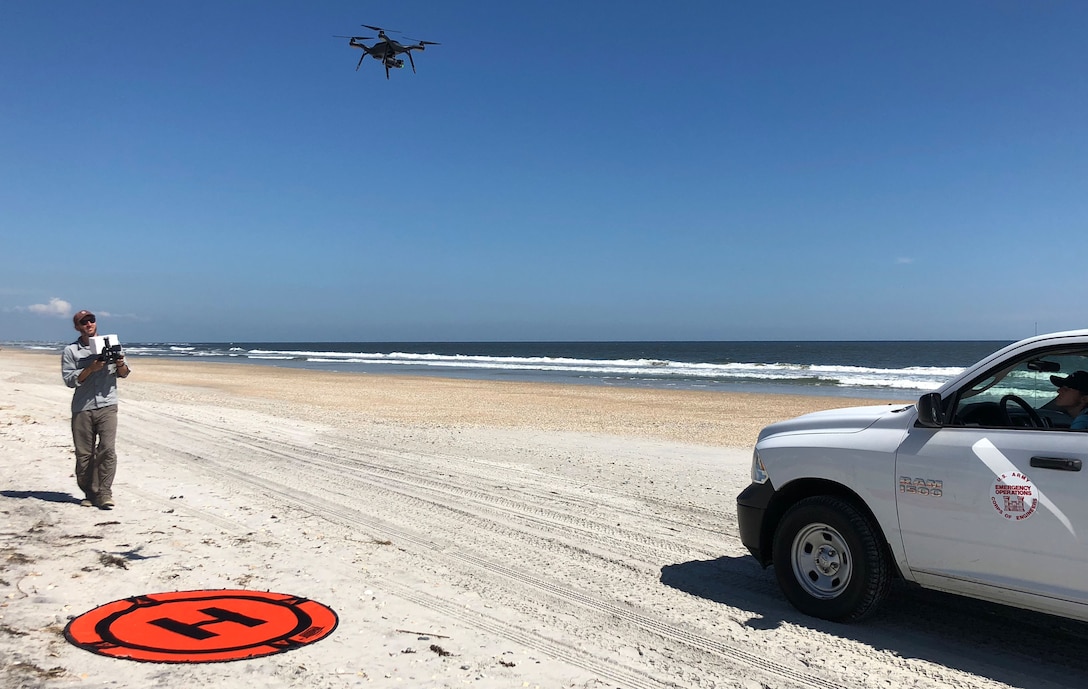 A team from the USACE Field Research Facility (FRF) based at Duck, NC collects data with a drone at Wrightsville Beach. The data will help calculate the quantity of material lost due to Hurricane Florence. The Duck facility is part of the Corps' Engineer Research and Development Center (ERDC) headquartered in Vicksburg, Mississippi. (USACE photo by Trevor Lancaster)