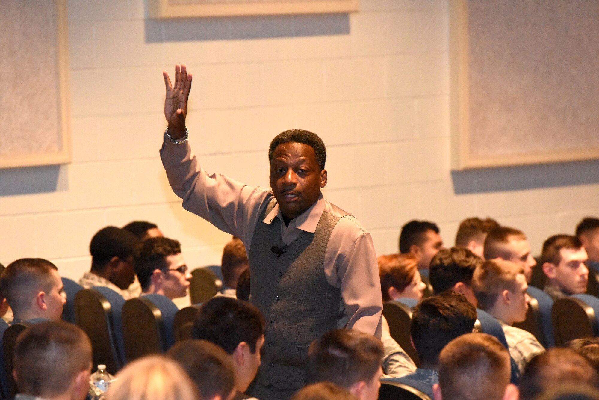 Retired U.S. Air Force Chief Master Sgt. Anthony Brinkley, guest speaker for the Goodfellow Total Development Council, shares a personal story with Goodfellow service members during his discussion at the base theater on Goodfellow Air Force Base, Texas, Sept. 26, 2018. Brinkley focused on encouraging junior enlisted members to commit to themselves and help each other through their careers. (U.S. Air Force photo by Airman 1st Class Seraiah Hines/Released)