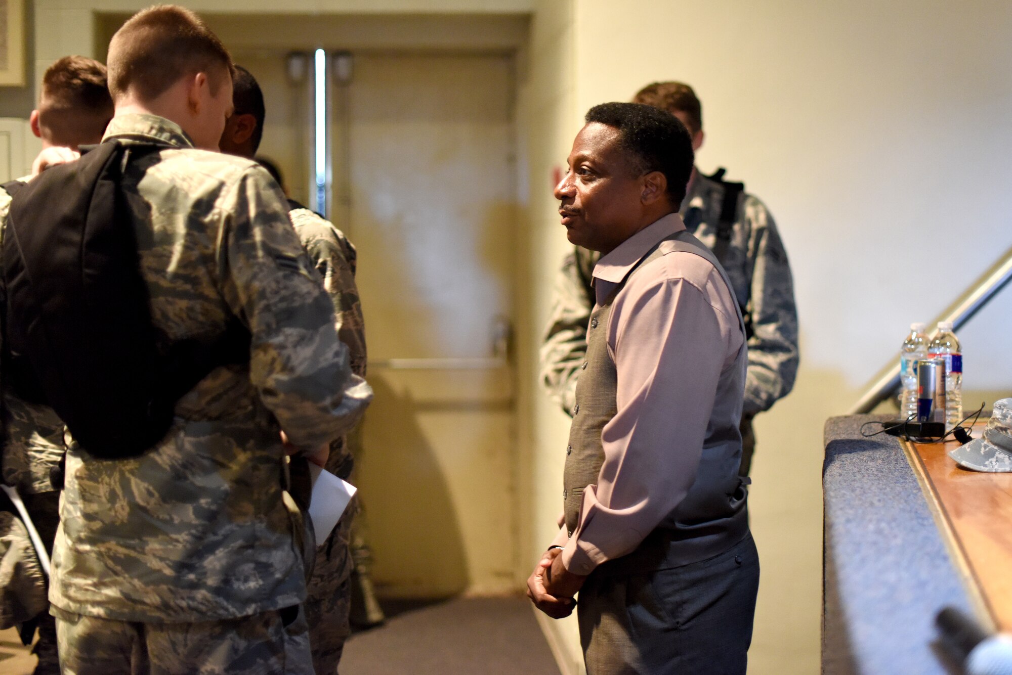 Retired U.S. Air Force Chief Master Sgt. Anthony Brinkley, guest speaker for the Goodfellow Total Development Council, takes time after his discussion to engage with Airmen who attended at the base theater on Goodfellow Air Force Base, Texas, Sept. 26, 2018. Brinkley is a recognized leadership expert and has over 25 years of experience with the military, which he shared with the Airmen who attended his speech. (U.S. Air Force photo by Airman 1st Class Seraiah Hines/Released)