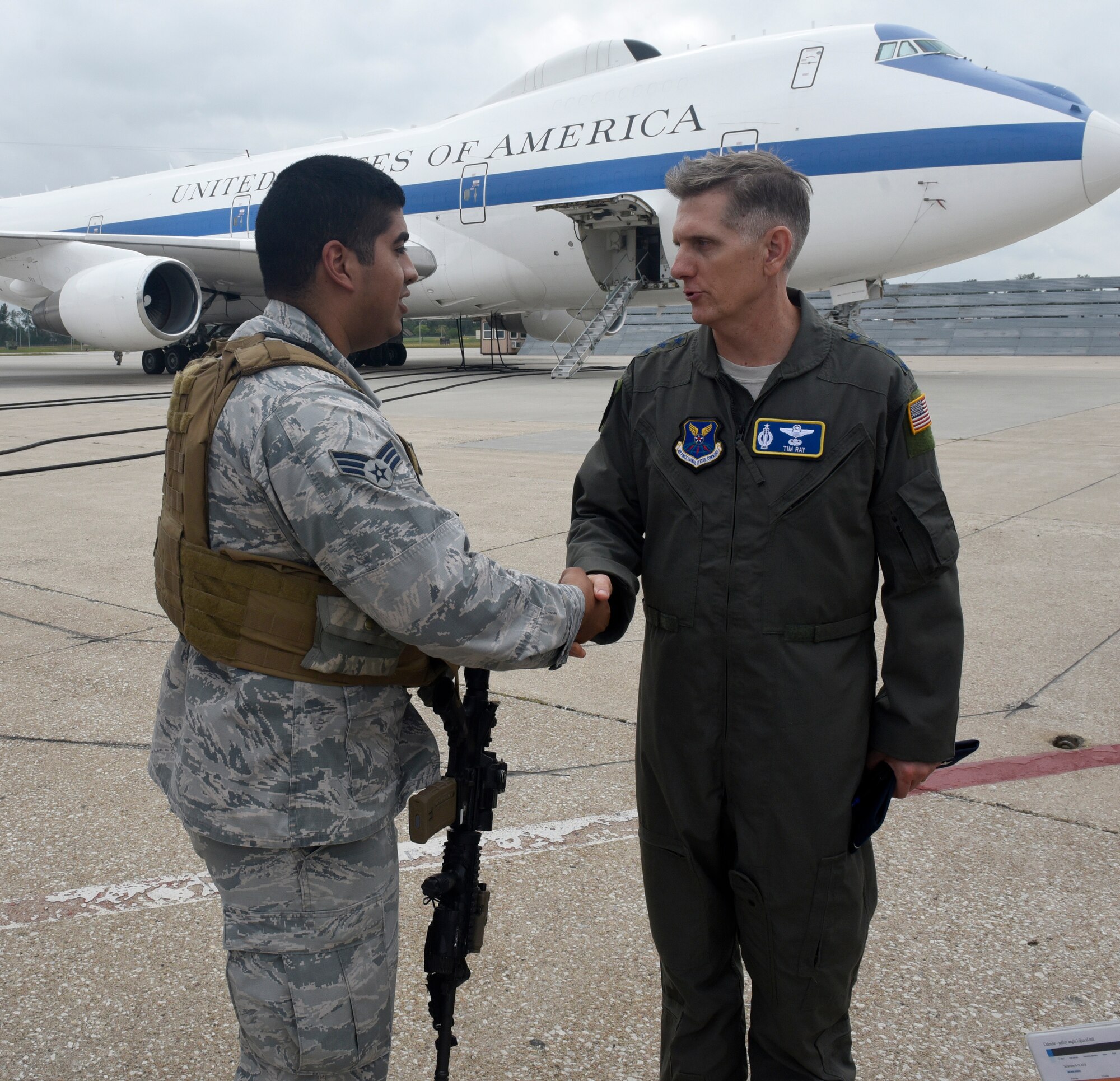 U.S. Air Force Gen. Timothy Ray, Air Force Global Strike Command commander (right), shakes the hand of Senior Airman Ricardo Gonzalez, 55th Wing Security Forces Squadron, at an E-4B aircraft entry-control point Sept. 13, 2018 at Offutt Air Force Base, Nebraska. During his visit, the general met with the men and women who ensure a 24/7/365 direct connection between the president of the United States and all nuclear forces under his authority (U.S. Air Force photo by Drew Nystrom)