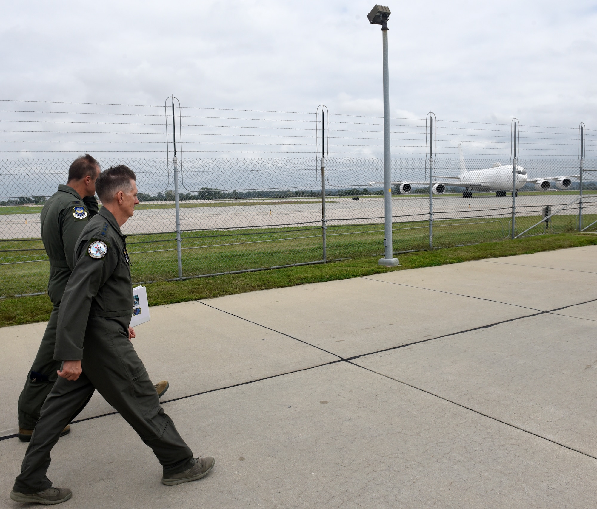 U.S. Air Force Gen. Timothy Ray, Air Force Global Strike Command commander walks the flightline as a U.S. Navy E-6B aircraft, with a crew which includes members of the 625th Strategic Operations Squadron, taxis at Offutt Air Force Base, Nebraska Sept. 13, 2018. The 625 STOS mission is unique to the ICBM community in that it provides the commander of United States Strategic Command with a secondary Minuteman III launch capability through the Airborne Launch Control System. Housed aboard the Navy's E-6B aircraft, the ALCS serves as a vital backup to Minuteman launch control centers. (U.S. Air Force photo by Drew Nystrom)