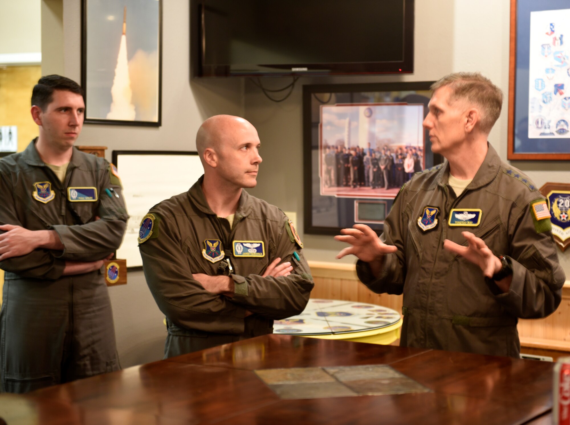 U.S. Air Force Gen. Timothy Ray, Air Force Global Strike Command commander, addresses a point made by U.S. Air Force Capt. Jared Fairchild, a 625th Strategic Operations Squadron Airborne Launch Control System officer, during a discussion at Offutt Air Force Base, Nebraska Sept. 13, 2018. The 625 STOS mission is unique to the ICBM community in that it provides the commander of United States Strategic Command with a secondary Minuteman III launch capability through the Airborne Launch Control System. Housed aboard the Navy's E-6B aircraft, the ALCS serves as a vital backup to Minuteman launch control centers. (U.S. Air Force photo by Drew Nystrom)