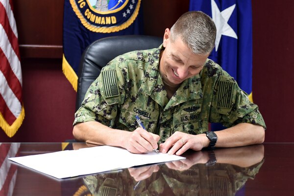 U.S. Navy Rear Adm. Richard Correll, U.S. Strategic Command (USSTRATCOM) director of plans and policy, signs an agreement to share Space Situational Awareness services and information with Netherlands at USSTRATCOM headquarters on Offutt Air Force Base, Neb., Sept. 21, 2018.