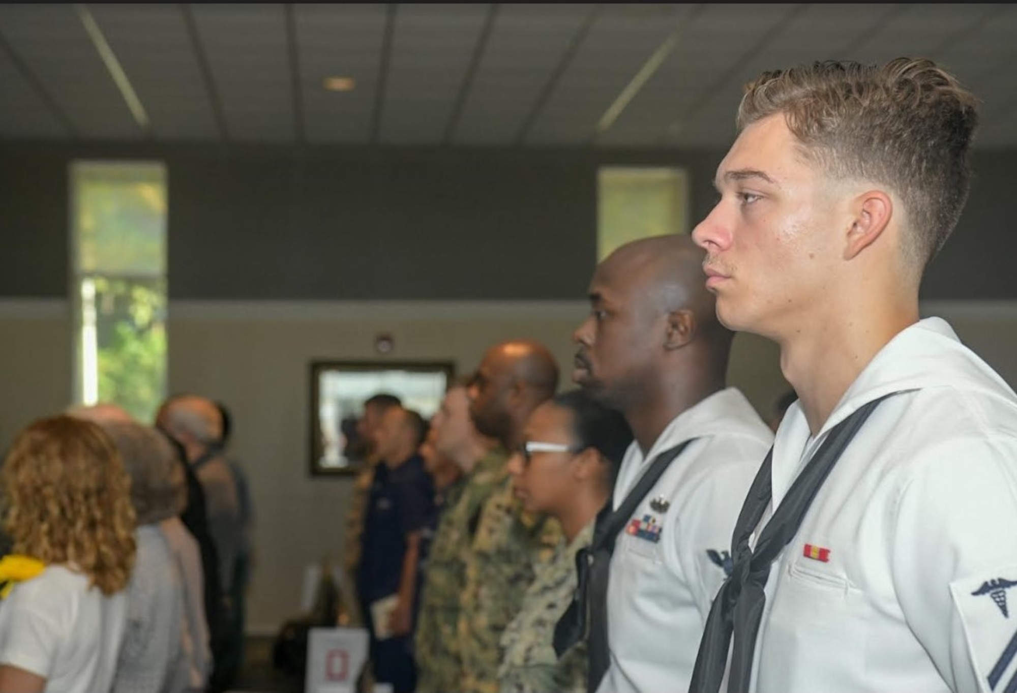 Sailors, Airmen and family members of fallen service members, gather during the Bells Across America memorial ceremony Sept. 27, 2018, at Joint Base Charleston, S.C. The ceremony is an annual U.S. military tradition held across the country to honor and commemorate fallen service members. During the ceremony, a bell is rung after each service member’s name is read.