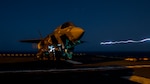 U.S. Marines with Marine Fighter Attack Squadron 211, 13th Marine Expeditionary Unit (MEU), load ordnance into an F-35B Lightning II aboard the Wasp-class amphibious assault ship USS Essex (LHD 2) in preparation for the F-35B's first combat strike, Sept. 27, 2018. The Essex is the flagship for the Essex Amphibious Ready Group and, with the embarked 13th MEU, is deployed to the U.S. 5th Fleet area of operations in support of naval operations to ensure maritime stability and security in the Central Region, connecting the Mediterranean and the Pacific through the western Indian Ocean and three strategic choke points. (U.S. Marine Corps photo by Cpl. A. J. Van Fredenberg/Released)