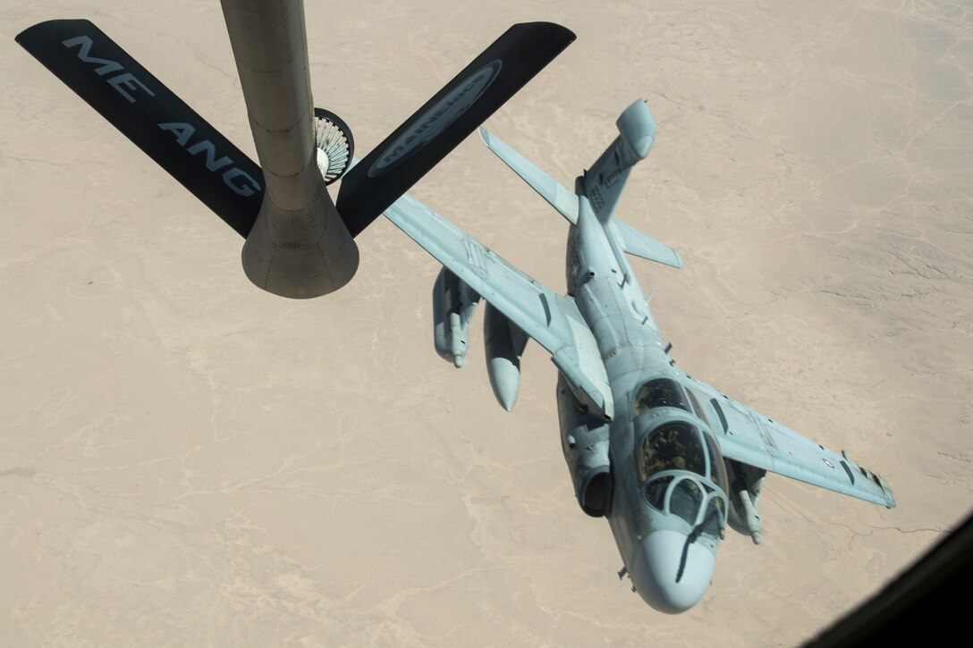 A U.S. Marine Corps EA-6B Prowler, assigned to Marine Tactical Electronic Warfare Squadron 2, banks away after receiving in-flight fuel from a KC-135 Stratotanker assigned to the 28th Expeditionary Air Refueling Squadron (EARS) during an aerial refueling mission in support of Operation Inherent Resolve over Iraq, June 28, 2018. The 28th EARS is assigned to the 379th Expeditionary Operations Group and supports various operations in countries such as Iraq, Syria and Afghanistan. In conjunction with partner forces, Combined Joint Task Force - Operation Inherent Resolve defeats ISIS in designated areas of Iraq and Syria and sets conditions for follow-on operations to increase regional stability. (U.S. Air Force photo by Staff Sgt. Keith James)