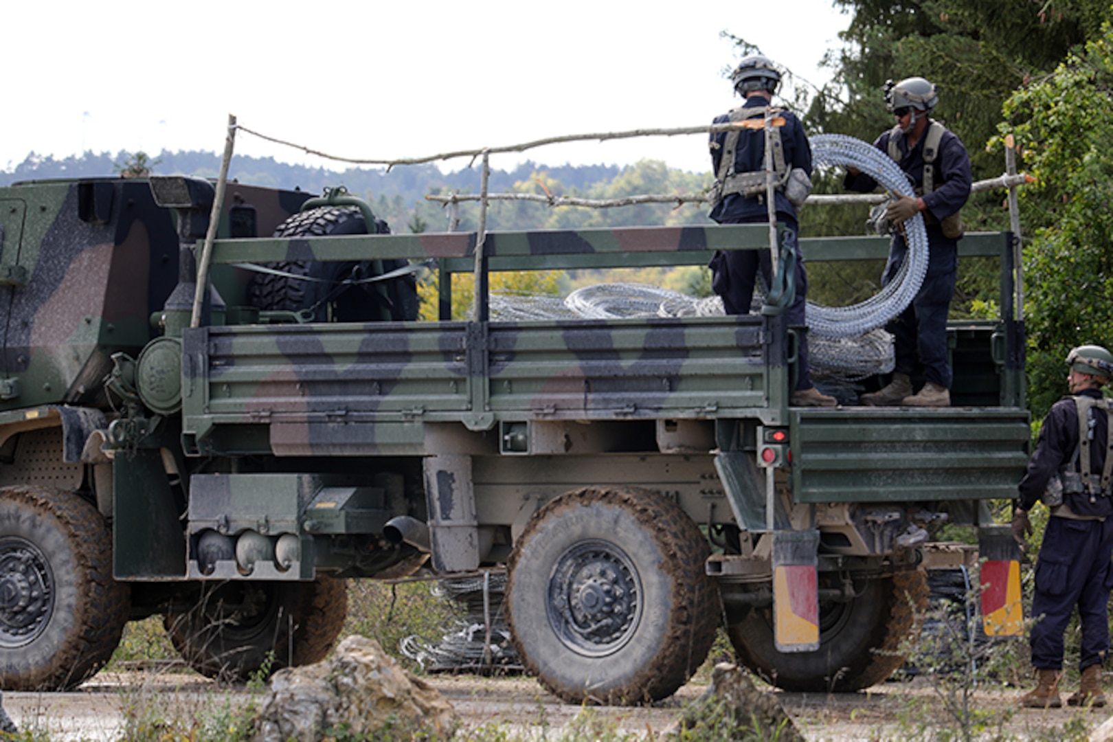 Soldiers from the 119th Sapper Company, West Virginia National Guard, unload concertina wire in preparation for placement in a Hohenfels training area. The 119th is a part of the opposing force which simulates the enemy during the exercise scenarios. Saber Junction 18 is the 173rd Airborne Brigade’s combat training center certification exercise, taking place on the Grafenwoehr and Hohenfels training areas, Sept. 4 to Oct. 1, 2018.