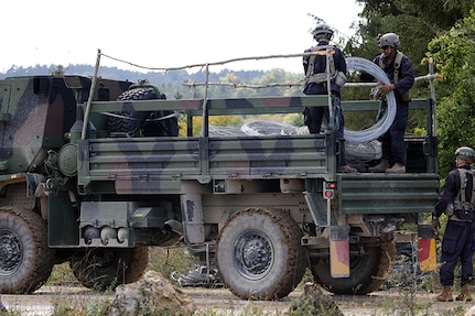 Soldiers from the 119th Sapper Company, West Virginia National Guard, unload concertina wire in preparation for placement in a Hohenfels training area. The 119th is a part of the opposing force which simulates the enemy during the exercise scenarios. Saber Junction 18 is the 173rd Airborne Brigade’s combat training center certification exercise, taking place on the Grafenwoehr and Hohenfels training areas, Sept. 4 to Oct. 1, 2018.