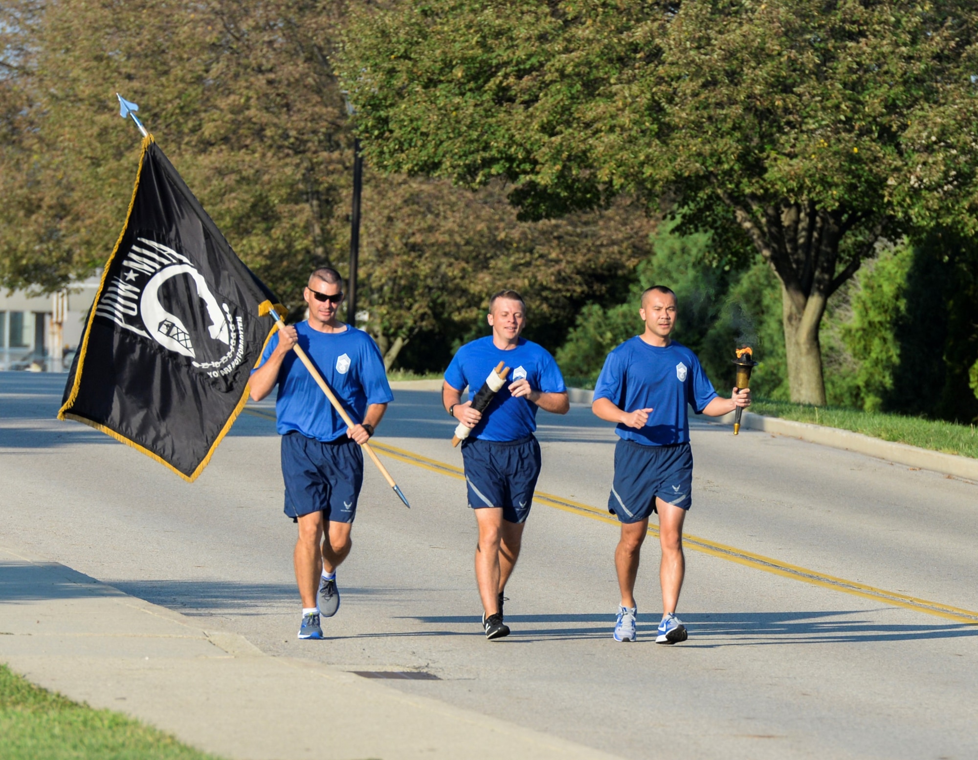 Members of the Wright-Patterson Chiefs Group run the last leg of the POW/MIA 24-hour run and overnight vigil at Wright-Patterson Air Force Base, Ohio, Sept. 21, 2018. The run concluded at the base POW/MIA wreath laying ceremony. (U.S. Air Force photo/Wesley Farnsworth)