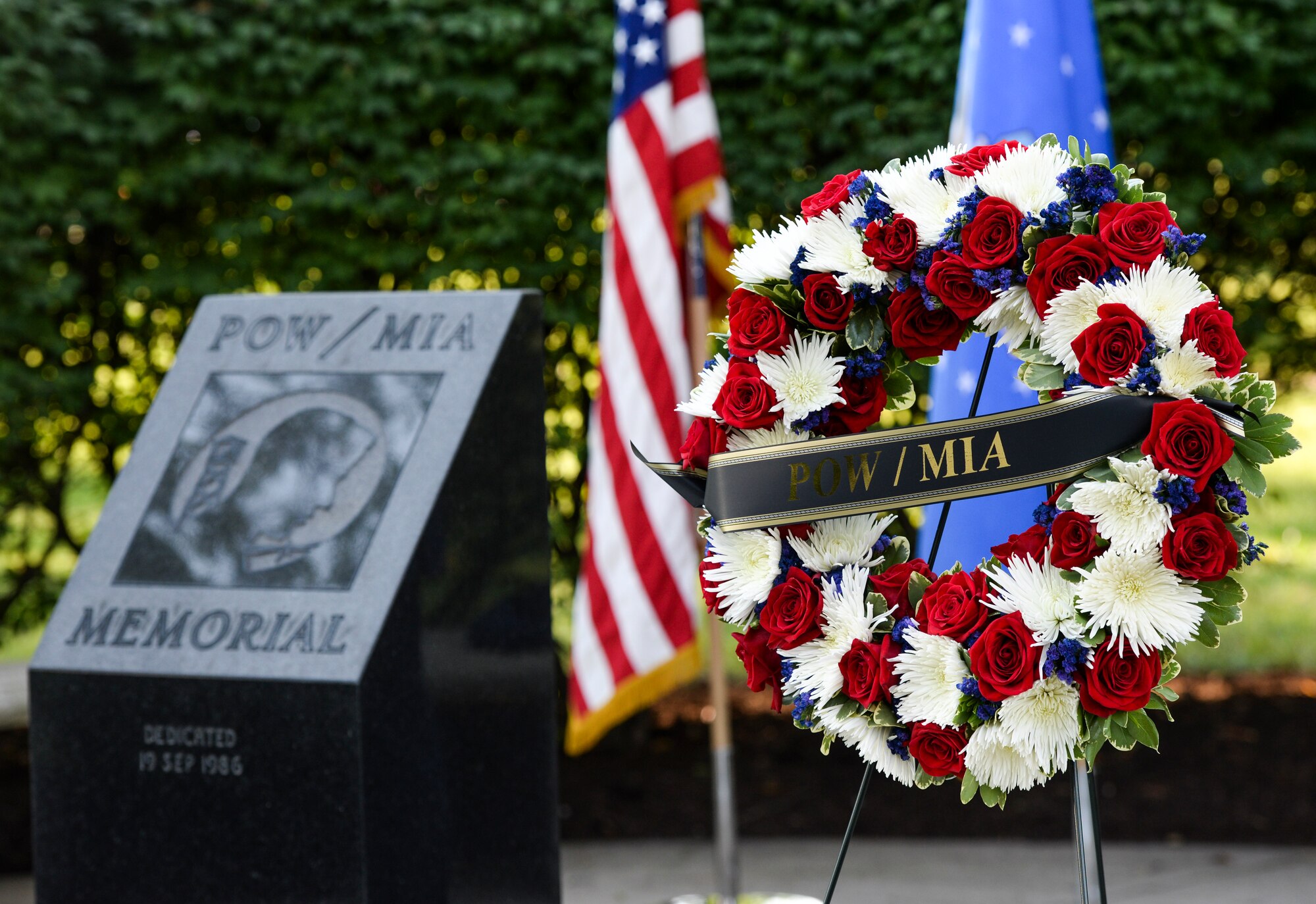 A wreath sits on a stand at the POW/MIA memorial at the Arnold House in Area A, Wright-Patterson Air Force Base Sept. 21. The wreath was placed during a POW/MIA ceremony which was held for base personnel as part of National POW/MIA Recognition Day. (U.S. Air Force photo/Wesley Farnsworth)