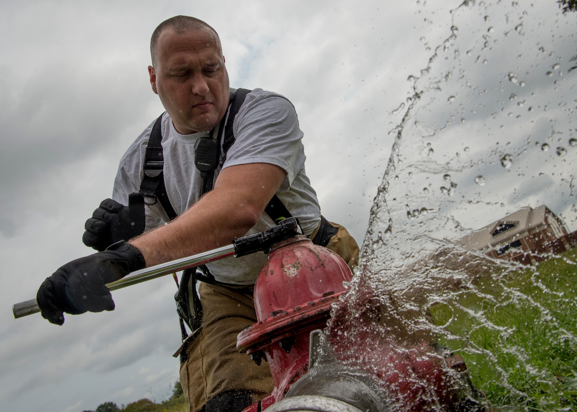 James Sneddon, 633rd Civil Engineer Squadron lead firefighter, participates in a fire training exercise at Joint Base Langley-Eustis, Va., Sept. 20, 2018. During the exercise, firefighters participated in real-world scenarios, including fixing broken fire hydrants as well as finding alternate locations to supplement their water needs at response sites. (U.S. Air Force photo by Staff Sgt. Areca T. Bell)