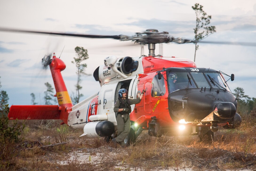 A Coast Guard Air Station Clearwater MH-60 Jayhawk aircrew search for survivors of Hurricane Florence in North Carolina, Sept. 18, 2018.  Coast Guard air stations from around the country have sent aircraft and personnel to Air Station Elizabeth City, where response efforts are being coordinated.