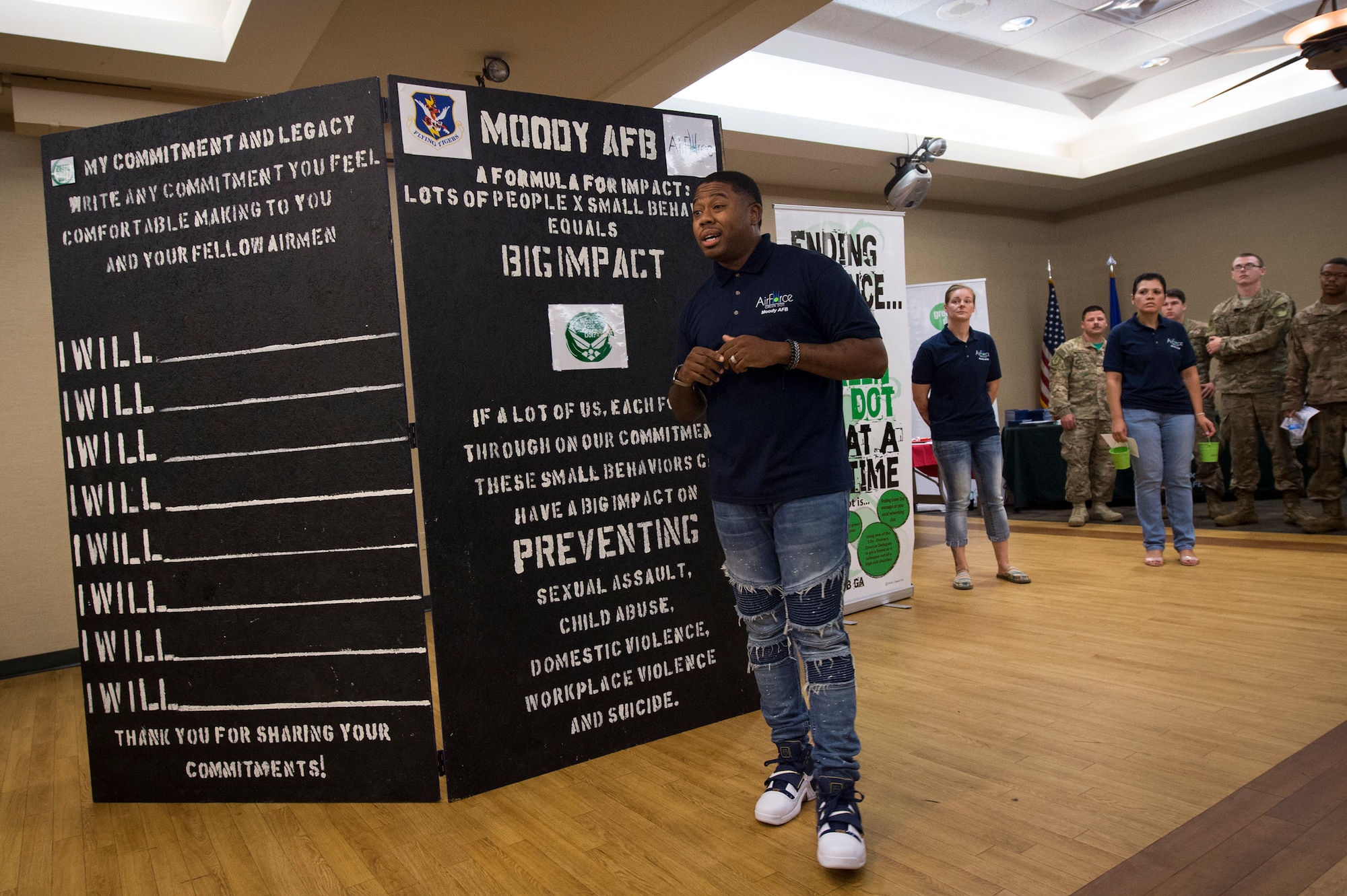 Staff Sgt. Darrius Williams, 23d Medical Group Green Dot instructor, addresses the crowd during the unveiling of the Green Dot Commitment Board, Sept. 28, 2018, at Moody Air Force Base, Ga. The board was crafted for Airmen and by Airmen and will travel across the base allowing Airmen to write down their individual commitments. Green Dot is an Air Force program designed to reinforce the key principles of prevention that can be applied to many issues such as sexual assault, suicide prevention, domestic violence, stalking and child abuse prevention.