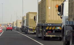 A convoy of vehicles heads to the Port of Masaieed, Qatar on Sept. 20 as part of the quarterly mission of the 831st Transportation Battalion. The 831st manages U.S. Army port operations in multiple countries throughout the area of responsibility, providing uninterrupted sustainment operations to warfighters in theater. (U.S. Army photo by: Sgt. 1st Class Lisa Rodriguez Presley, 143rd ESC Public Affairs)