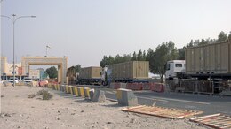 A convoy of vehicles enters the Port of Masaieed, Qatar on Sept. 20 as part of the quarterly mission of the 831st Transportation Battalion. The 831st manages U.S. Army port operations in multiple countries throughout the area of responsibility, providing uninterrupted sustainment operations to warfighters in theater. (U.S. Army photo by: Sgt. 1st Class Lisa Rodriguez Presley, 143rd ESC Public Affairs)