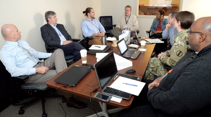 Vernon Petty, fourth from left, project manager with the Center of Standardization at Huntsville Center, and Tiffany Torres, fifth from left, former Value Engineering officer and value program manager, help facilitate a Value Engineering workshop in March of 2018 with members of the Army Center for Initial Military Training. Due to the COVID-19 shutdown, the Huntsville Center VE program has offered the last five VE workshops virtually.