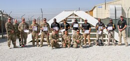 Contractors, Soldiers and Department of the Army Civilians congratulate contestants of the K9 Competition that occurred here on Bagram Airfield, Afghanistan. The K9 competition, held September 16, 2018, consisted of four events: detection, obedience, agility and controlled aggression. In each event, the working dog teams were evaluated on their expedience to complete the task, their accuracy, their focus and their obedience to their handler’s commands. Based on these evaluations, the nine working dog teams (three U.S. Army teams and six AMK9 contractor teams) were awarded corresponding points and the team that ended up with the most points won. (U.S. Army photo by: Staff Sgt. Caitlyn Byrne, 101st Sustainment Brigade Public Affairs)
