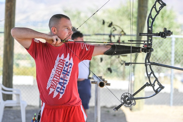 Marine Cpl. T.J. Gilman from Wounded Warrior Batallian West at Camp Pendleton, California, aims his compound bow during a Paralympic Archery Training Camp. Sept. 25, 2018 at Hill Air Force Base. Hill hosted the camp Sept. 24-28 through the Paralympic Military Program, which is run by the United States Olympic Committee in partnership with the U.S. Department of Defense and U.S. Department of Veterans Affairs. (U.S. Air Force photo by Cynthia Griggs)