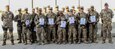 Soldiers of the 101st Resolute Support Sustainment Brigade proudly hold up their certificates of achievement after being recognized in an award ceremony for earning their German proficiency marksmanship badge on Bagram Airfield, Afghanistan, Sept. 14. (U.S. Army photo by: Spc. Alexes Anderson 101st Sustainment Brigade Public Affairs)