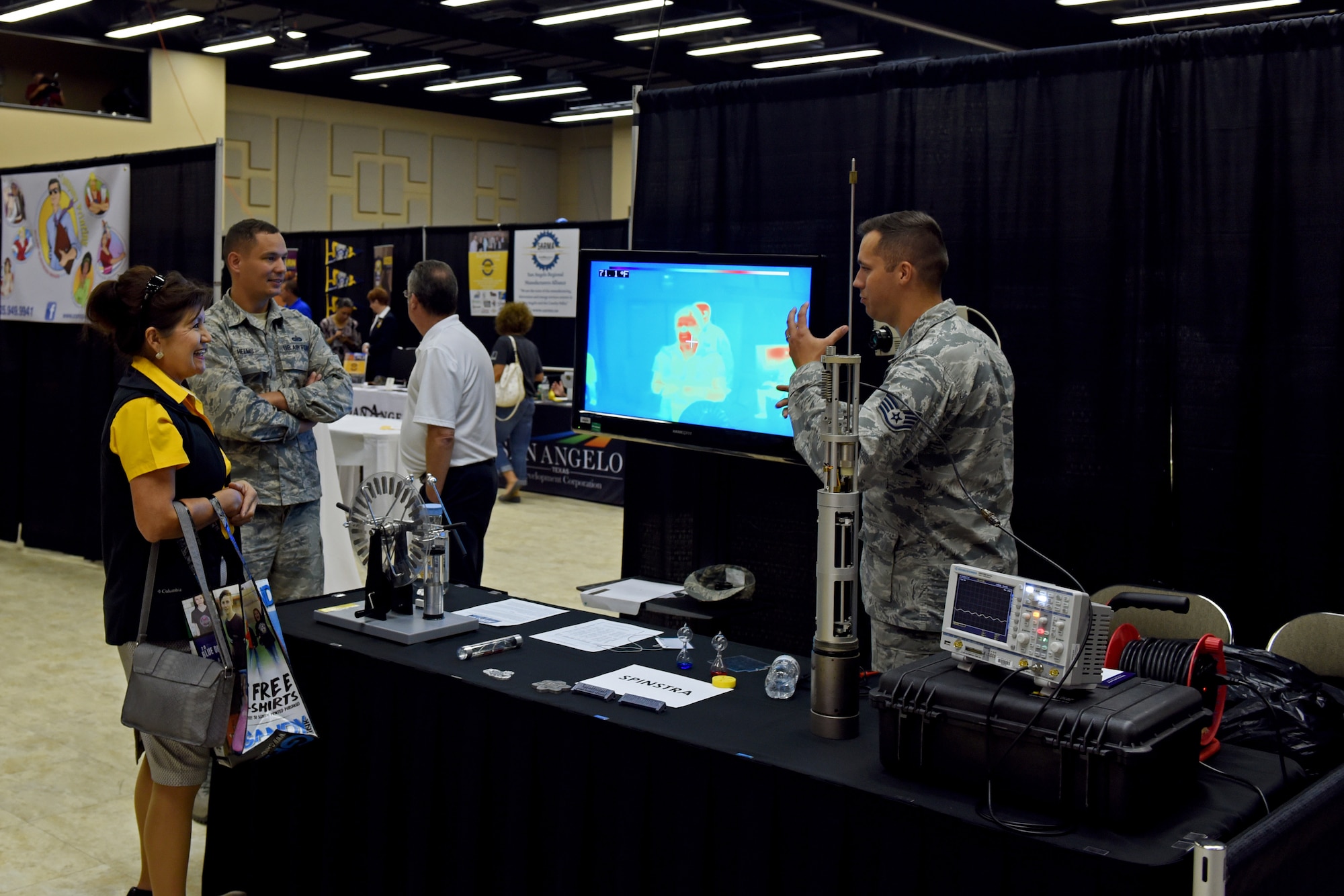 Attendees examine the 75 different booths during the Chamber of Commerce Business Expo at the McNease Convention Center, in San Angelo, Texas, Sept. 27, 2018. Booths were open to local oranizations along with Goodfellow Air Force Base, providing insight into job opportunities in the Conch Valley area. (U.S. Air Force photo by Airman 1st Class Zachary Chapman/Released)