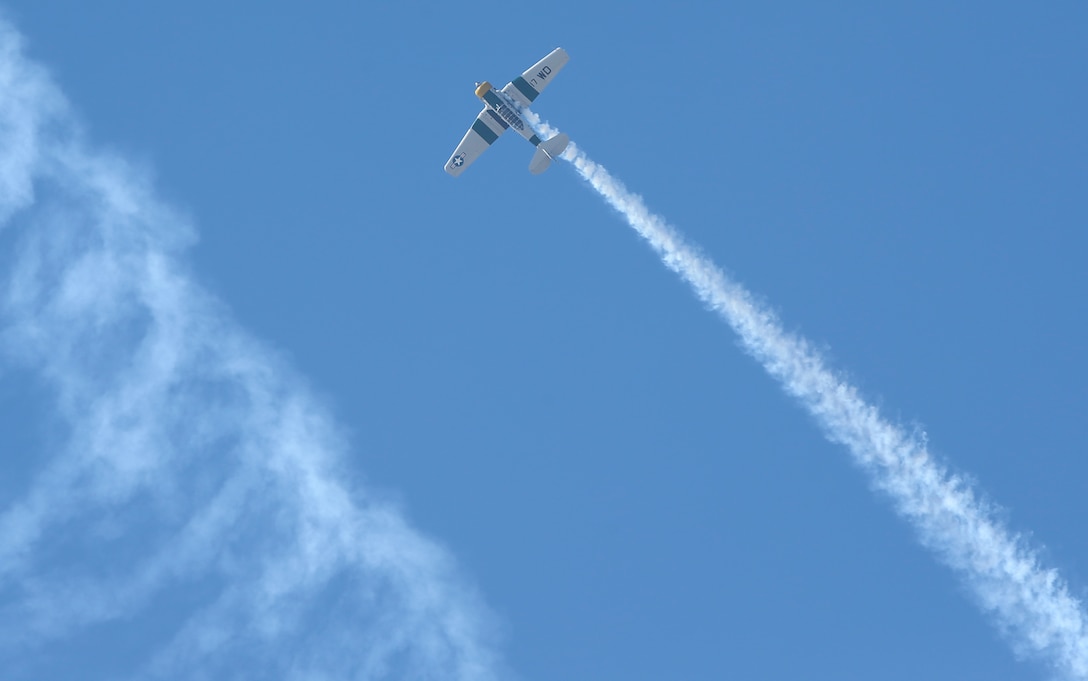 John A. Collver performs aerial maneuvers during the 2018 Marine Corps Air Station Miramar Airshow in a World War II-era AT-6 trainer at Marine Corps Air Station Miramar, Calif., Sept. 28. This year’s air show honors “100 years of women in the Marine Corps” by featuring several performances and displays that highlight accomplishments and milestones women made since the first female enlistee, Opha May Johnson, who joined the service in 1918. (U.S. Marine Corps photo by Cpl. Nadia J. Stark/Released.)