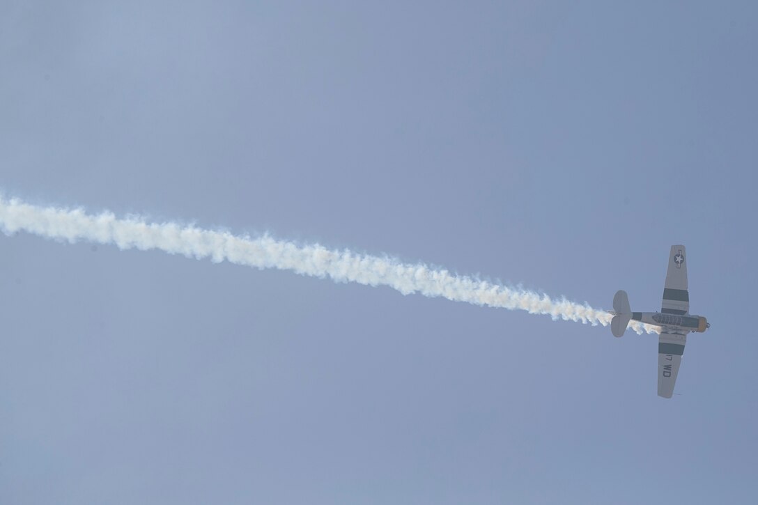 John Collver soars above the flight line in an AT-6 Texan “War Dog” during his performance at the 2018 MCAS Miramar Air Show aboard Marine Corps Air Station Miramar, Calif., Sept. 28. This year’s air show honors “100 years of women in the Marine Corps” by featuring several performances and displays that highlights accomplishments and milestones women since the first female enlistee, Opha May Johnson, who joined the service in 1918. (U.S. Marine Corps photo by LCpl Raynaldo D. Ramos)